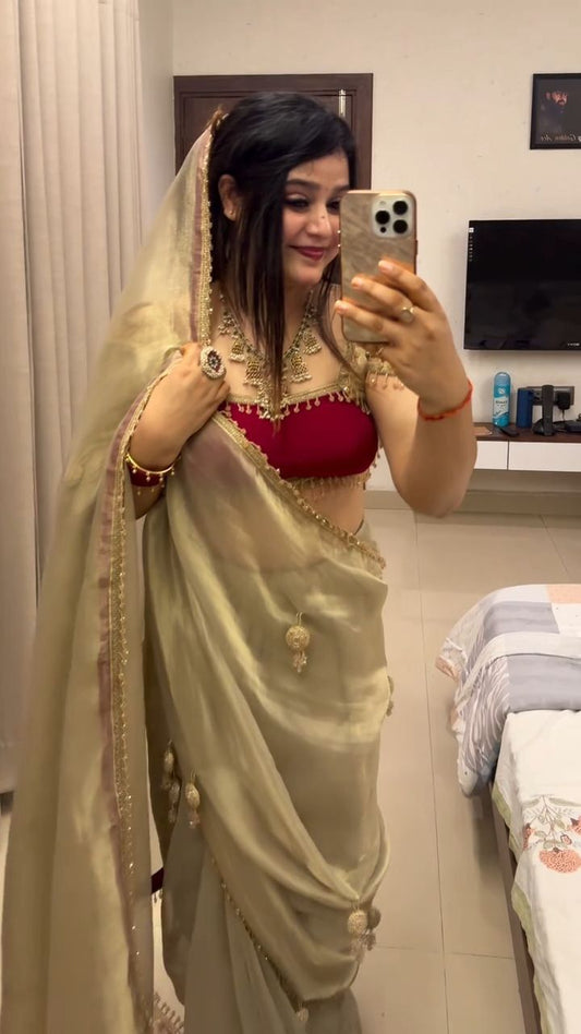 Golden Silk Saree with Designer Tassels & Red Blouse – Festive Wedding Wear